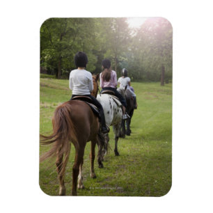 Little girls riding horses magnet