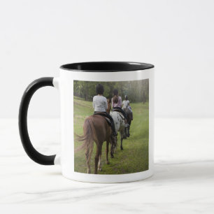 Little girls riding horses mug