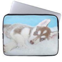 Little Husky Puppy Laying on a Blanket