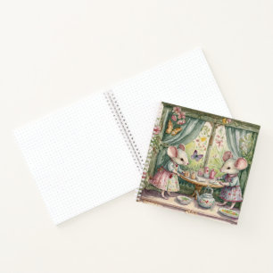 Little mouse at table bullet journal notebook