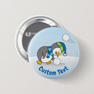 Little penguin getting a snow ball 6 cm round badge