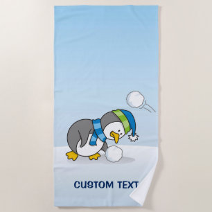 Little penguin getting a snow ball beach towel