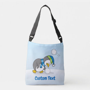 Little penguin getting a snow ball crossbody bag