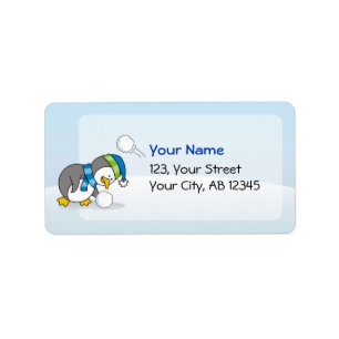 Little penguin getting a snow ball label