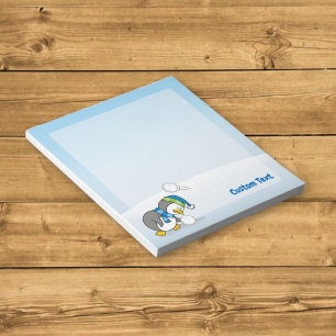 Little penguin getting a snow ball notepad