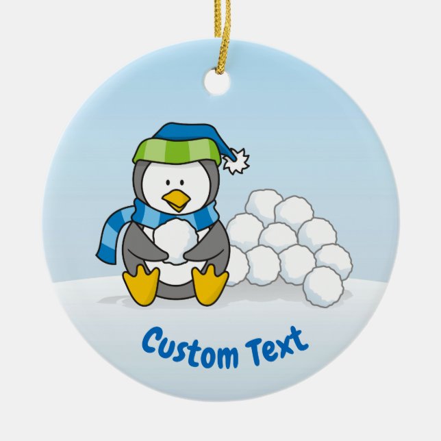 Little penguin sitting with snowballs ceramic tree decoration (Front)
