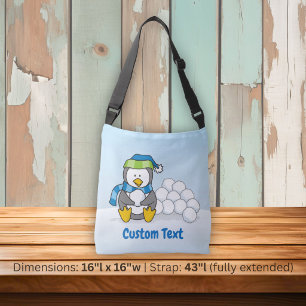 Little penguin sitting with snowballs crossbody ba bag