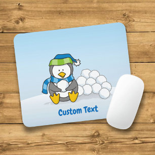Little penguin sitting with snowballs mouse pad