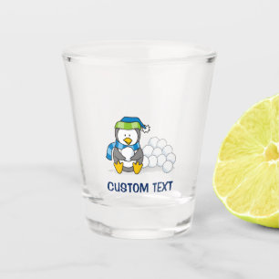 Little penguin sitting with snowballs shot glass