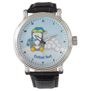 Little penguin sitting with snowballs watch