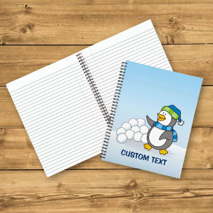 Little penguin with snow balls waving notebook