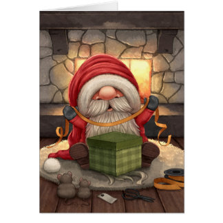 Little Santa wrapping a gift