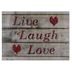 Live Laugh Love on the side of a barn Cutting Board