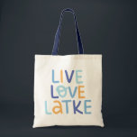Live Love Latke Hanukkah Design Tote Bag<br><div class="desc">Celebrate the joy of Hanukkah with this colourful "Live Love Latke" design. Featuring bright colours and playful typography,  this graphic is perfect for a variety of products,  from home decor to gifts. Add a touch of holiday spirit and deliciousness to your space with this fun and festive design.</div>