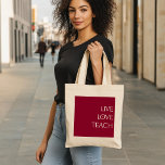 "LIVE LOVE TEACH" Deep Red and Cream Tote Bag<br><div class="desc">Show your passion for teaching with this elegant tote bag featuring the phrase "LIVE LOVE TEACH" in soft cream lettering against a rich deep red background. The minimalist design, set on a classic cream tote, makes this bag a perfect blend of style and functionality, ideal for teachers who carry inspiration...</div>