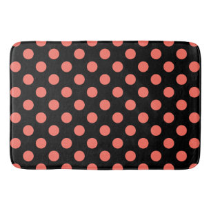 Living coral polka dots on black bath mat