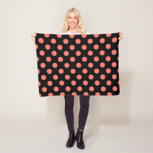 Living coral polka dots on black fleece blanket