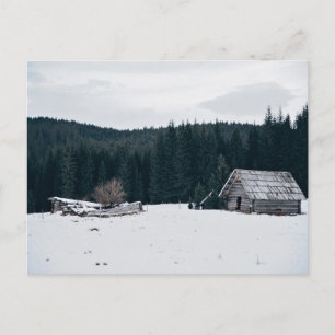 Log cabin in the snow postcard