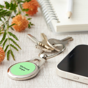 Logo With Light Green Background on Oval Metal Key Ring