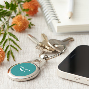 Logo With Teal Green Background on Oval Metal Key Ring