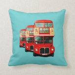 London Bus Cushion<br><div class="desc">Cushion (throw pillow) in a jade color illustrated with a montage of three London buses.  On the reverse is a single image of the London bus from times gone by.</div>