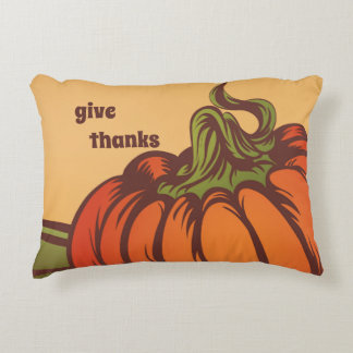 Lonely pumpkin one the field. Autumn leaves fall. Decorative Cushion