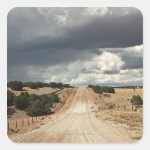Looking down a  dirt country road in NM with Square Sticker