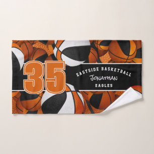 Lots of basketballs black orange team colours hand towel