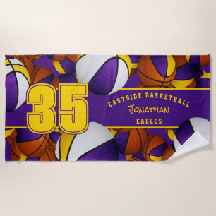 Lots of basketballs purple gold team colours beach towel