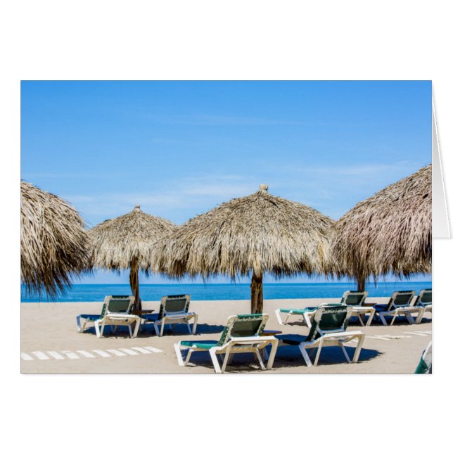 Lounge Chairs And Thatch Umbrellas On Beach (Front Horizontal)