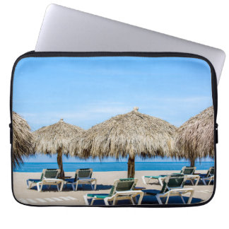 Lounge Chairs And Thatch Umbrellas On Beach Laptop Sleeve