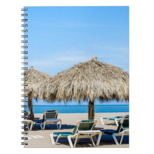 Lounge Chairs And Thatch Umbrellas On Beach Notebook