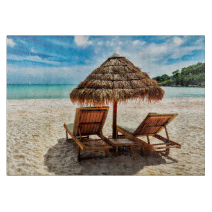 Lounge chairs on beach throw pillow cutting board