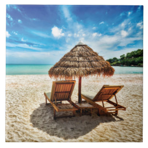 Lounge chairs on beach throw pillow tile