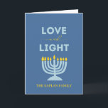 "Love and Light" Menorah Personalised Hanukkah Card<br><div class="desc">Send warm wishes for the Festival of Lights with this elegant "Love and Light" Hanukkah card. Featuring a glowing menorah design, a serene blue background, and customisable family text, this folded card is perfect for sharing heartfelt messages with loved ones. Whether you're celebrating all eight nights or sending blessings from...</div>