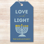 "Love and Light" Menorah Personalised Hanukkah Gift Tags<br><div class="desc">Add a meaningful touch to your Hanukkah gifts with these elegant "Love and Light" gift tags! Featuring a soothing blue background, a bright menorah illustration, and the uplifting message "Love and Light, " these tags are perfect for holiday presents, party favours, or festive decor. Customisable with your family name, they...</div>