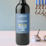 "Love and Light" Menorah Personalised Hanukkah Wine Label<br><div class="desc">Bring warmth and elegance to your Hanukkah table with these "Love and Light" wine labels! Featuring a serene blue background, a vibrant menorah illustration, and the heartfelt message "Love and Light, " these labels are perfect for adding a festive touch to your holiday gatherings. Customisable with your family name, they...</div>