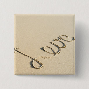 Love carved sign on the beach sand 15 cm square badge