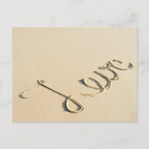 Love carved sign on the beach sand postcard