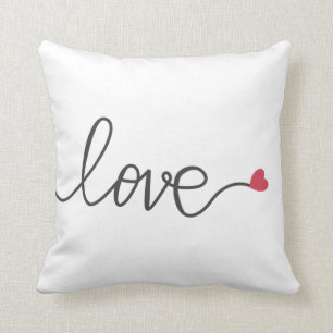 Love decorative text with heart cushion