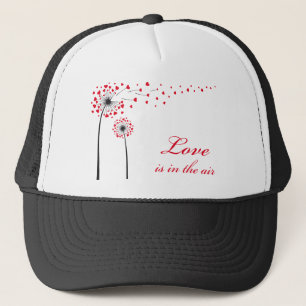 Love is in the air, dandelion with red hearts trucker hat