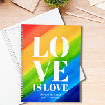 Love is Love Rainbow Colours Planner<br><div class="desc">This colourful Planner is decorated with LOVE IS LOVE in bold white typography on a watercolor rainbow background of red,  orange,  yellow,  green,  and blue.
It is easily customisable with your name and year.
Original Watercolor © Michele Davies.</div>