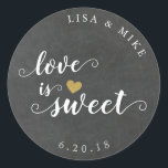 Love is Sweet Custom Wedding Favour Chalkboard Classic Round Sticker<br><div class="desc">Custom-designed wedding candy buffet favour stickers featuring gold glitter heart and "Love is Sweet" in elegant hand brushed script/calligraphy on a vintage rustic chalkboard background. Personalise this wedding favour sticker with bride and groom's names and wedding date for a touch of style to your wedding favours and gifts.</div>