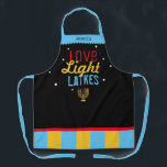 Love Light Latkes Black Hanukkah Funny Quote Apron<br><div class="desc">Love Light Latkes Black Hanukkah Funny Quote Apron is totally hipster cool! This colourful, humourous saying really stands out on the black starry-night background. Sure to make friends & Family smile. Includes a menorah icon and space for your name. Need help with this design? Want to see other colours or...</div>