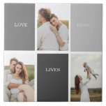 Love Lives Here | Three Photo Family Gift Tile<br><div class="desc">Presenting a heartwarming and personalised gift that celebrates the essence of family, featuring a beautiful grey frame adorned with a touching "Love Lives Here" quote and three cherished photos. Every time the recipient catches a glimpse of this remarkable gift, their heart will be filled with fond memories and a profound...</div>