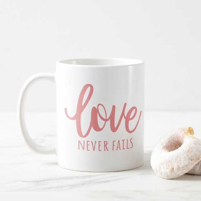 Love Never Fails - 1 Corinthians 13:8 Pink Coffee Mug (With Donut)