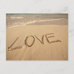 'Love' sand written on the beach with incoming Postcard