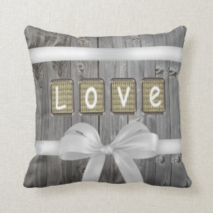 LOVE stitched on old light brown fabric Cushion