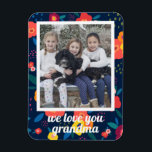 Love You Grandma Floral Photo Personalised Magnet<br><div class="desc">Say "We love you grandma" with this photo magnet framed in a vibrant floral pattern. Text is in a modern script font and customisable. Part of a collection from Parcel Studios.</div>