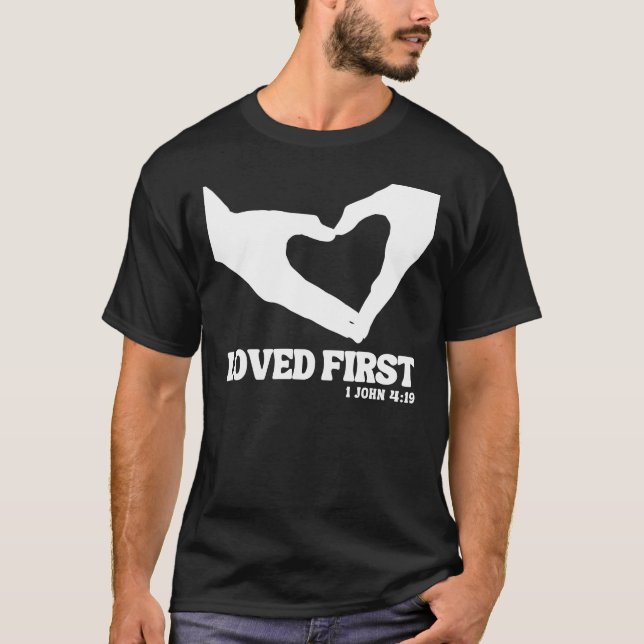 Loved First – 1 John 4:19 T-Shirt (Front)